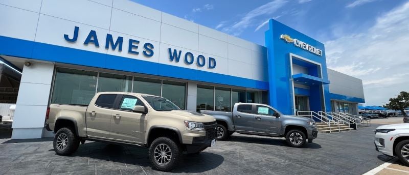 Dealership exterior with trucks