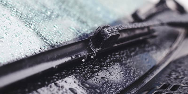 Tom Clark Chevrolet in Denton TX close up of wiper blades covered in raindrops